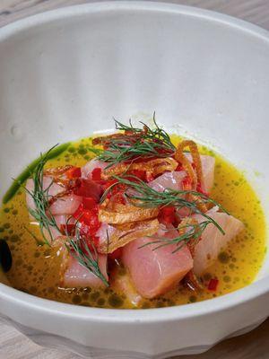 Hamachi crudo with tiger's milk, a split orange sauce. Good, but not great finding a pin bone in the fish ig: eatwithtako