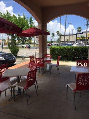 Outdoor seating area in the shopping strip.