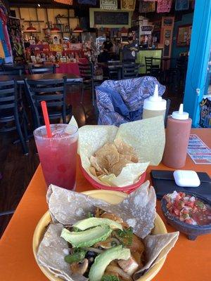 Hibiscus margarita, chips and salsa, house verde and red salsa and the whole some bowl