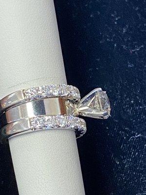 Kim chose to set the center stone in a four prong setting, allowing more light to shine through the diamond.