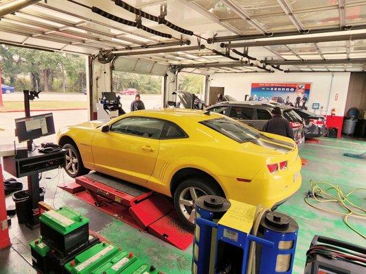 Cars being serviced in the garage.