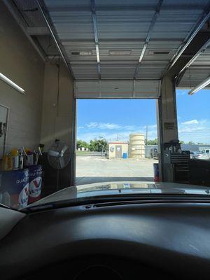 Bay where they do oil changes, Annual Vehicle Inspections with Stacy or Joseph.