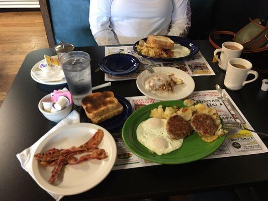 Two breakfast specials with an extra Side of bacon and a cinnamon roll. And my wife....