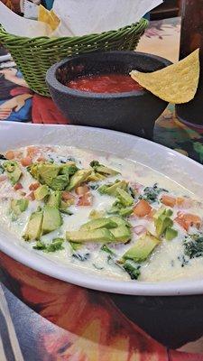 El Rey dip. Eat like a king get this dip fresh queso, tomato, avocado, spinach. Delicious