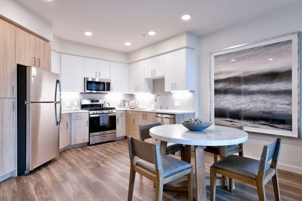 C-Shaped kitchen with lots of cabinet space into dining area