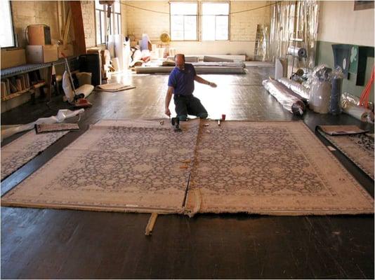 We make custom area rugs! Our Rug Fabrication department combined two rugs together for a client that needed a special rug size.