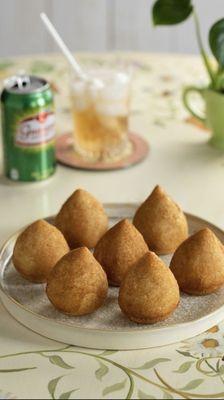 Coxinha( chicken croquettes made w/ potato dough, shredded chicken and Brazilian cream cheese.