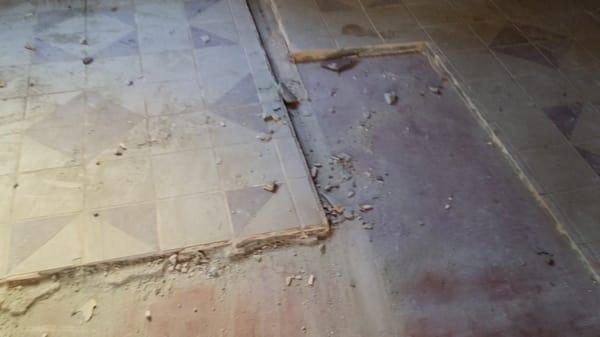 1 Inch thick floor, made up of two layers of ceramic tile over a hard layer of thinset.