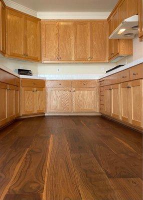 Walnut hardwood floor and honey oak cabinets