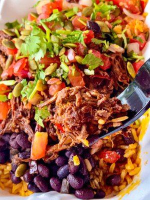 beef barbacoa bowl over rice - nice amount of flavorful and well seasoned beef barbacoa