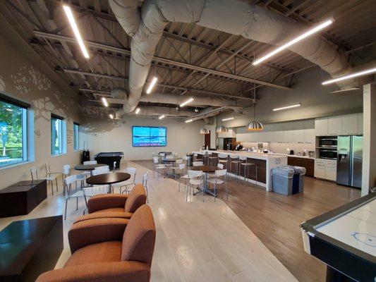 Break room with pool table, air hockey, and pinball machine