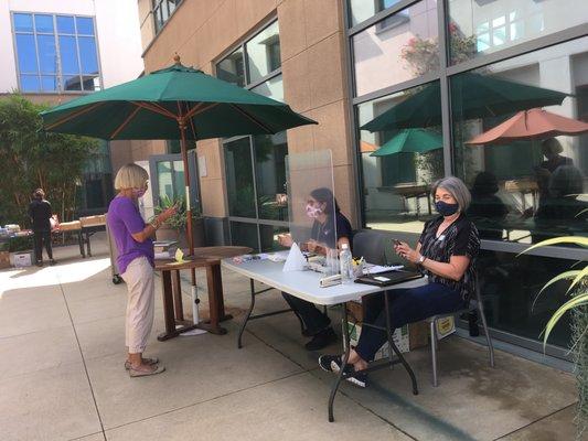 Cashiers are located outside for safety and distancing.