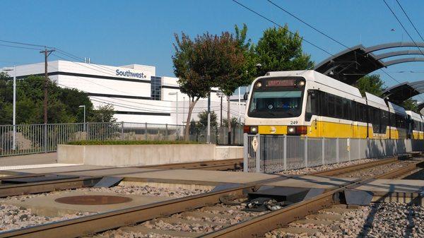 Here, you see a Green or Orange Dart train passing in front of Southwest Airlines HQ, thus near Love Field.