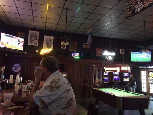 Large barroom with pool table.