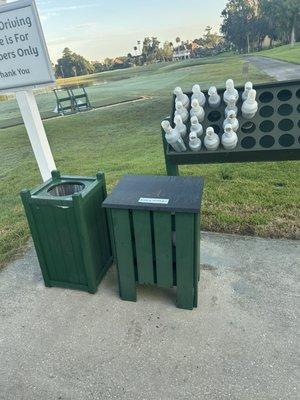 At the range, this box has score cards and mosquito repellent. Grab a magic sand bottle for your divots