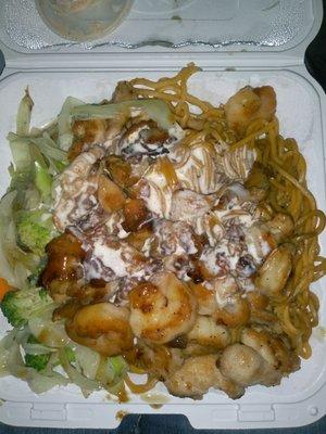 Shrimp and chicken with veggies and noodles. With yum yum sauce on top