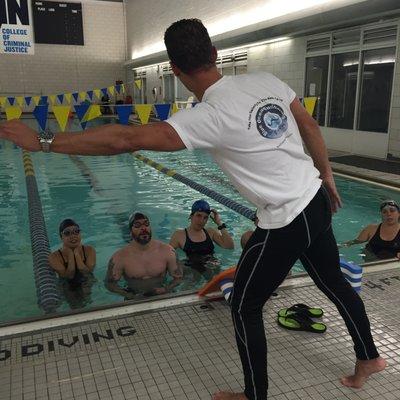 Swimmers in the Freestyle Training Group get ready to work on coach Valentin's drill set