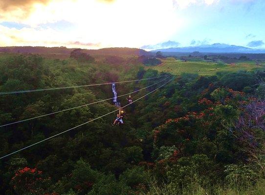 Sunset flight at the amazing eighth zipline over the 250' waterfall!