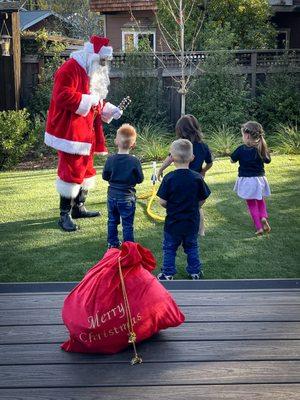 Hire Santa for a JOYOUS home visit. Local San Francisco company, Holiday of Wonders.