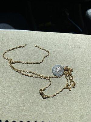 Broken necklace from haircut