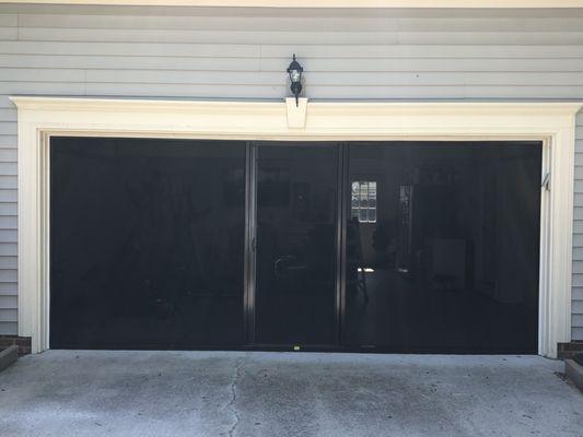 Lifestyle Screen with retractable door. Brownstone frame with black super screen.