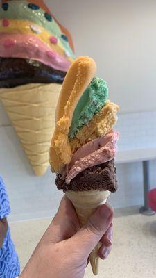 Original rainbow ice cream in a cake cone.