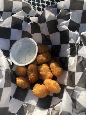 Half devoured white cheese curds.