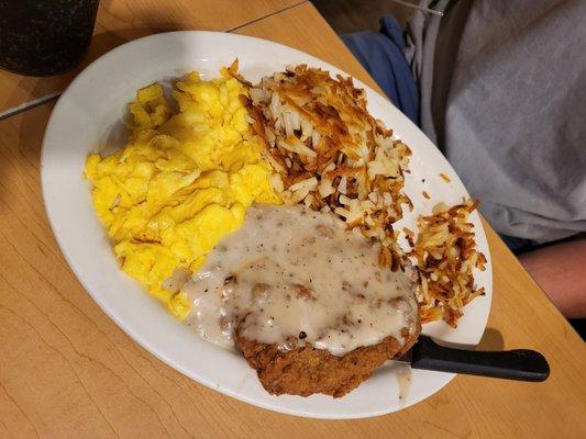 Country fried steak with scrambled eggs