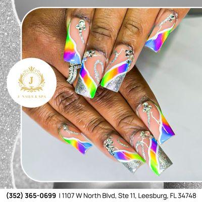 Sweet rainbow nails, a perfect combination of vibrant colors and delicate details.  Visit J Nails & Spa today to get your desired nails!