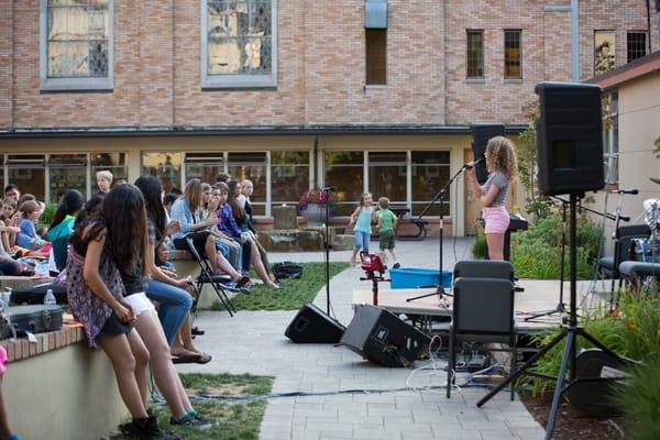 Outdoor stage! gorgeous evening and the sound was SO much better than inside. Kids used the whole courtyard to enjoy the event!