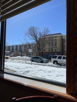 View from inside of restaurant of street.