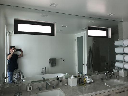 Bathroom mirror on backsplash