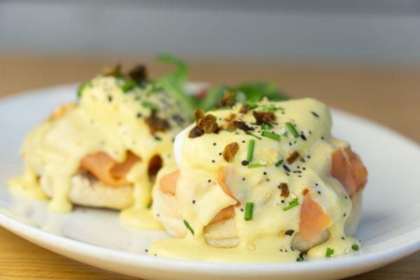 Smoked Salmon Eggs Benedict: Poached eggs and smoked salmon on an English
muffin covered in a caper-butter hollandaise sauce
and chives.