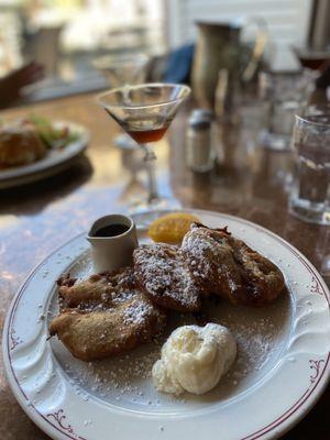 Cold brew martini sided with cinnamon roll French toast and sweet cream cheese side