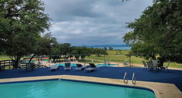 The Adult Pool overlooking the Family Pool, with a stunning  view of #canyonlake