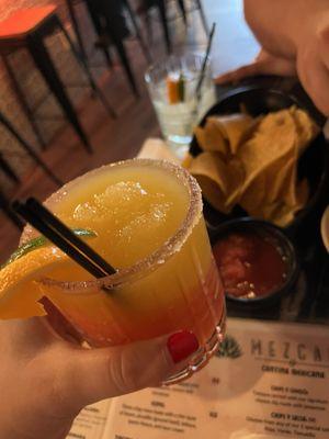 Frozen mango and strawberry margarita