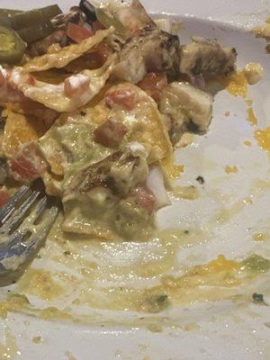 We ate half of the nachos to show you what the insides look like but the cheese is very fake and the chicken is very dehydrated