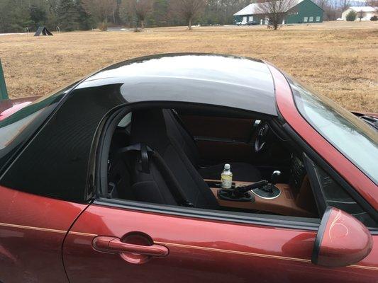 Sparkling Black hardtop on a 2006 copper red mica MX-5