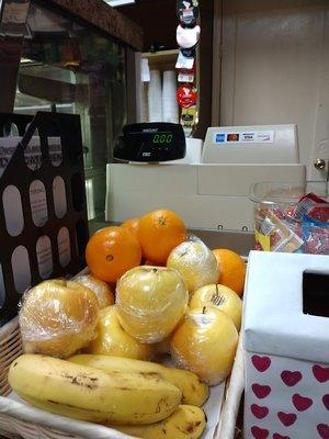 deli register and fresh wrapped fruit