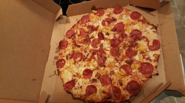 Pepperoni pizza with pineapple and bacon