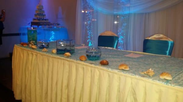 Main Table with fish & lighting, cake in background