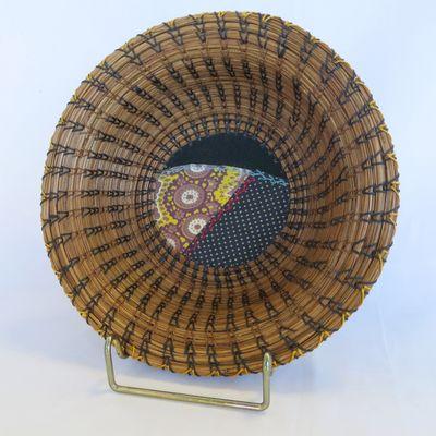 Longleaf pine needle baskets by local artist.  We have traditional woven baskets, too!