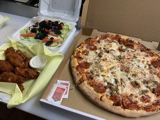 Our Very Popular Pizza Special!    Large Pizza (2 Topping) Large Salad, 12 Wings!