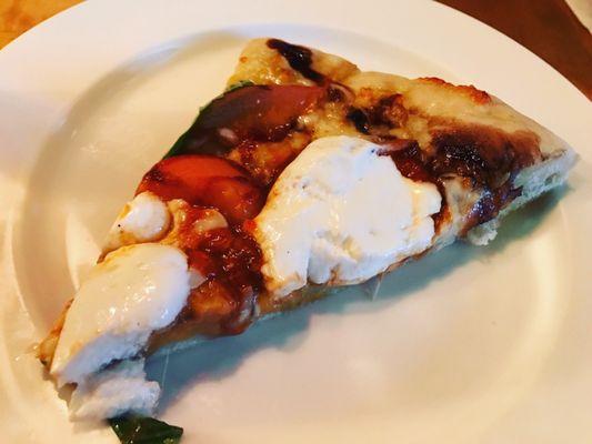 Millions of Peaches Pizza: mozzarella, roasted peaches, balsamic glaze, red pepper tomato sauce, Greek yogurt, and basil