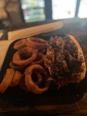 Steak sandwich with onion rings