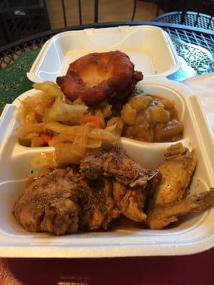 Jerk chicken with cabbage and curry potatoes.