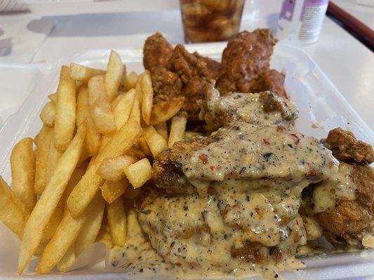 Garlic parmesan and spicy garlic breaded traditional wings and fries.