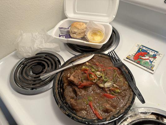 8/17/23 Smothered pork chops and grits, with buttermilk biscuits.