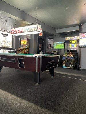 Game room with a pool table, Golden Tee, Buck Hunter, pin ball, and touch tunes.