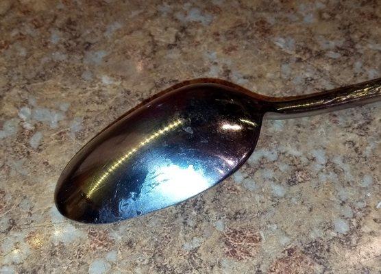 Notice the flaking of the silver off the bottom of this tablespoon made by Cambridge.